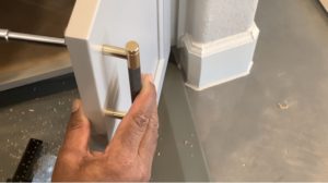 Final install cabinet pulls on door